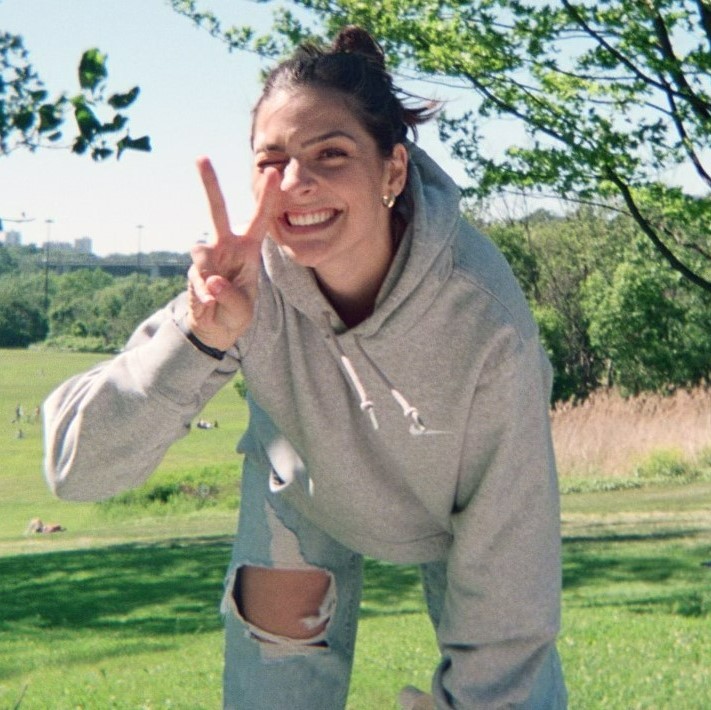 person holding up a peace sign