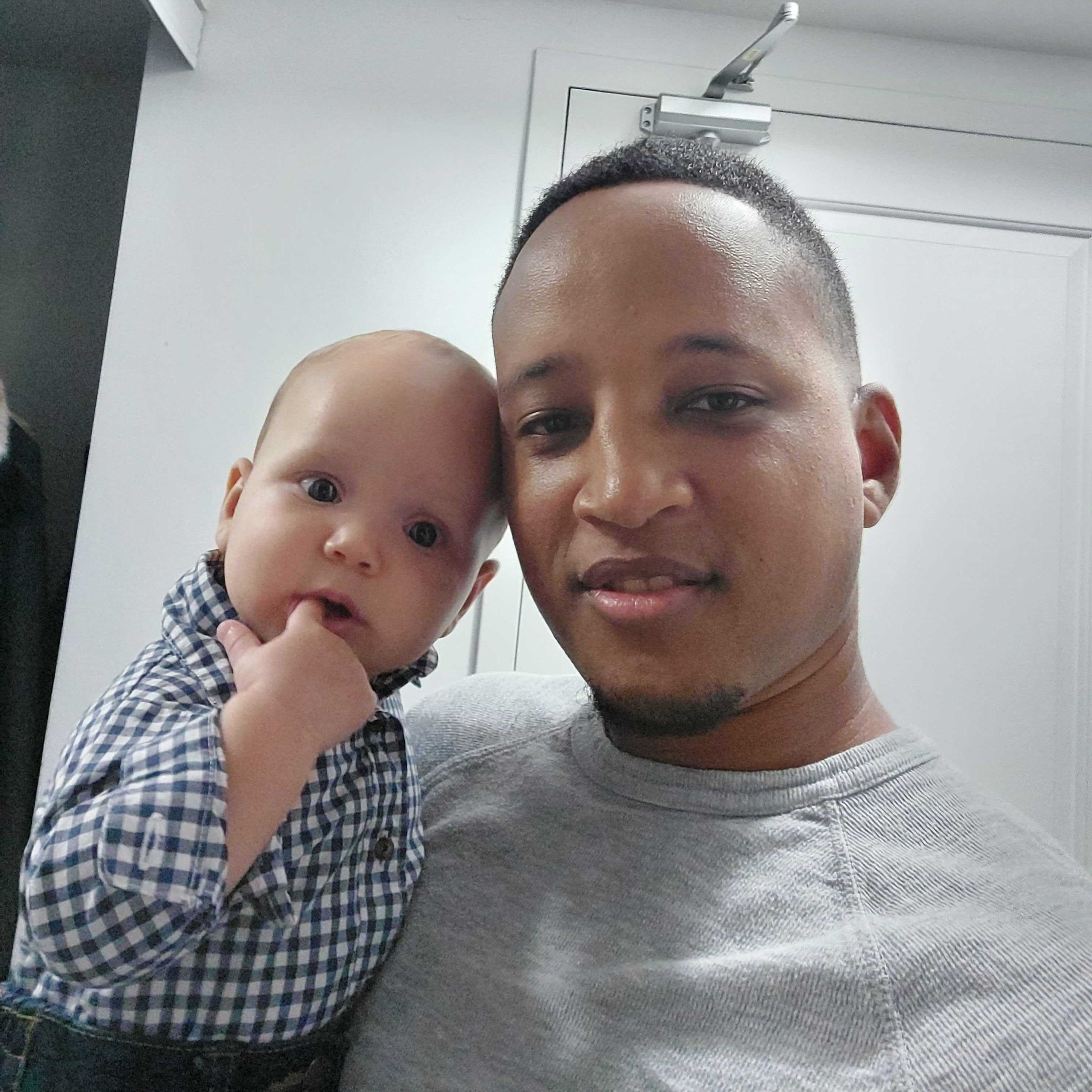 person and baby smiling